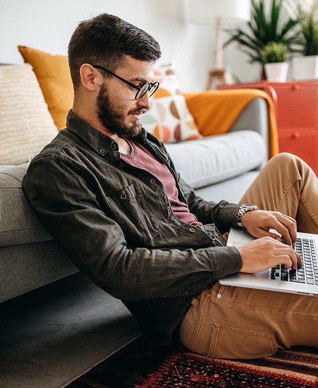 man using laptop at home