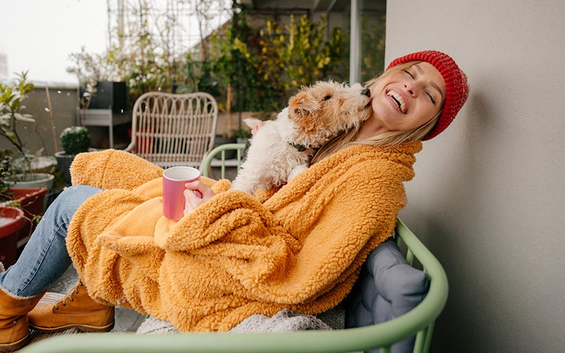 woman with dog on deck