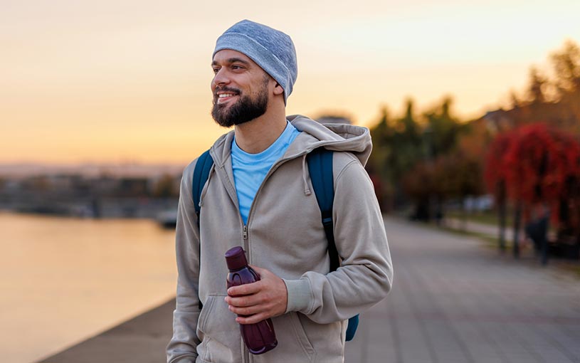 man walking at sunset