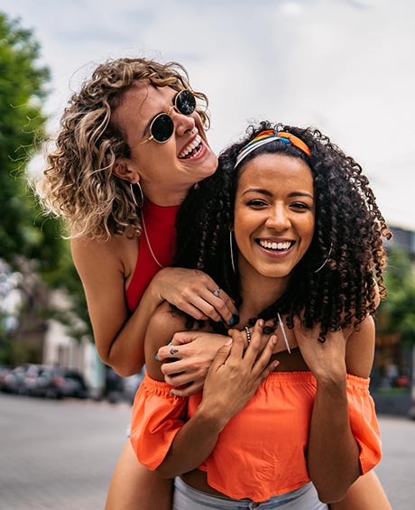 friends giving a piggy back ride