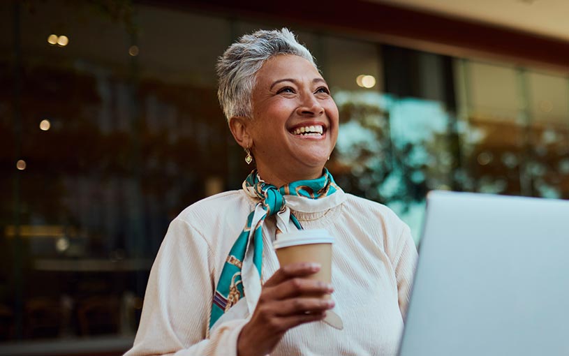 woman with coffee and laptop
