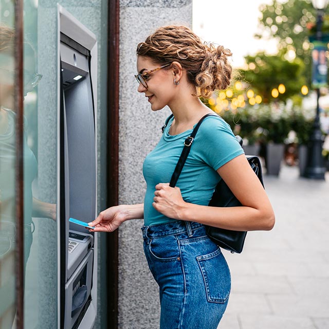 Woman using an ATM