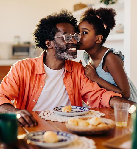 man and daughter at breakfast