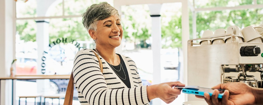 Woman using her debit card