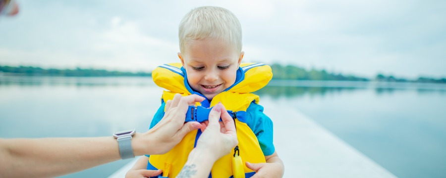 Little boy with life jacket on