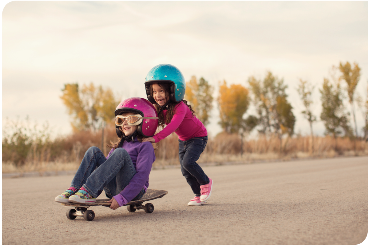 Kids playing outside with helmets on